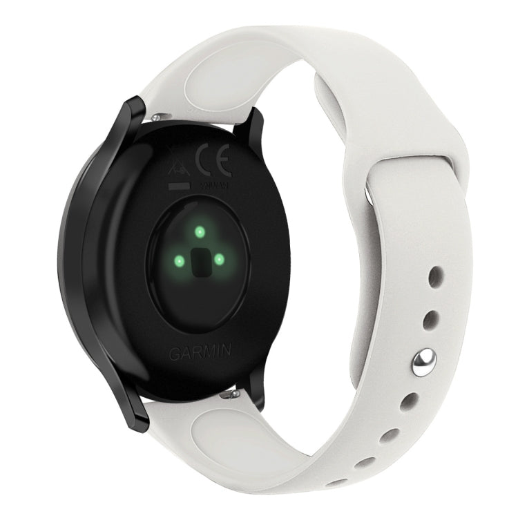 White silicone watch strap with reverse buckle, size small, close-up on band holes