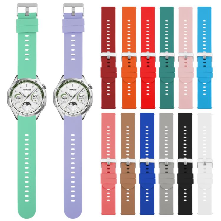 Silicone watch bands in assorted colors, including mint and lavender bands fitted to watches
