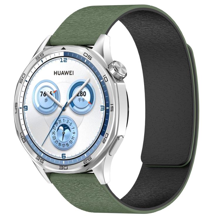 Dark green silicone magnetic watch band with textured outer surface and black inner surface, fitted to a watch.
