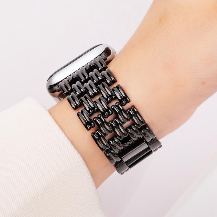 Black five-bead stainless steel watch band worn on the wrist