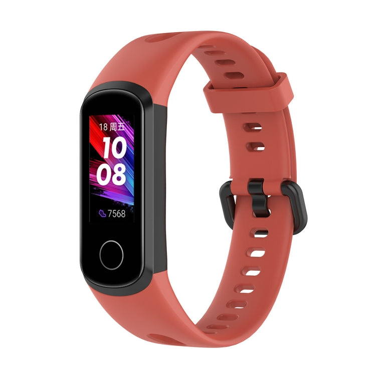 Orange silicone smartwatch strap with metal buckle and perforated adjustment holes