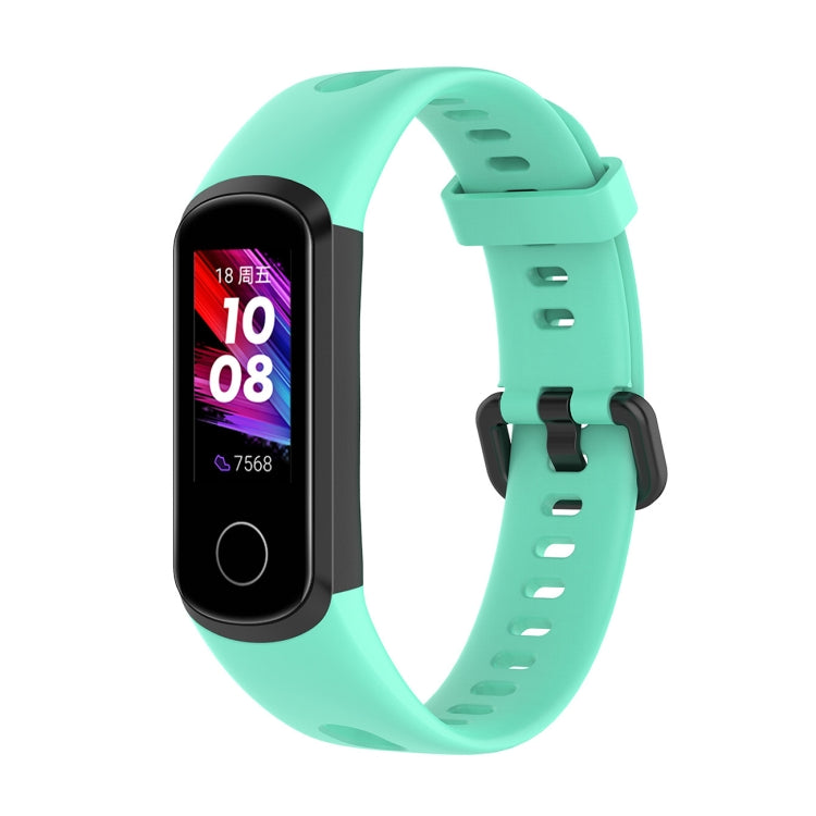 Mint green silicone smartwatch strap with metal buckle and perforated adjustment holes