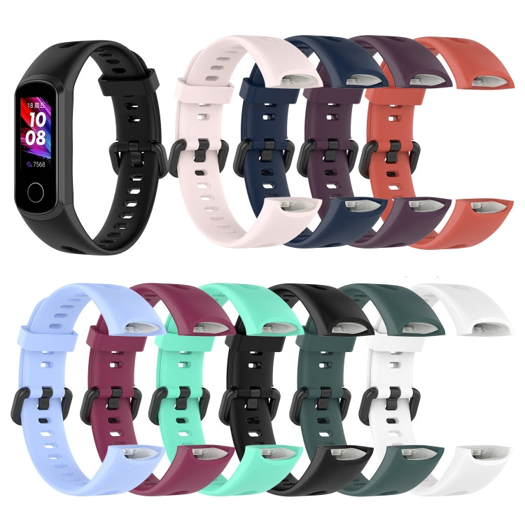 Assorted silicone smartwatch straps with metal buckles in multiple colors