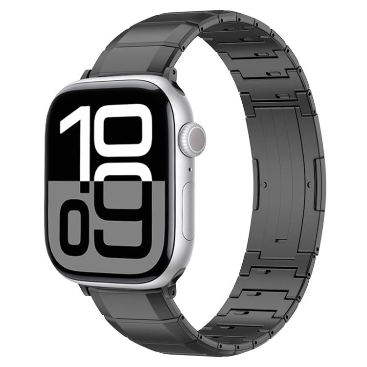Black titanium link band on a silver Apple Watch with digital time display