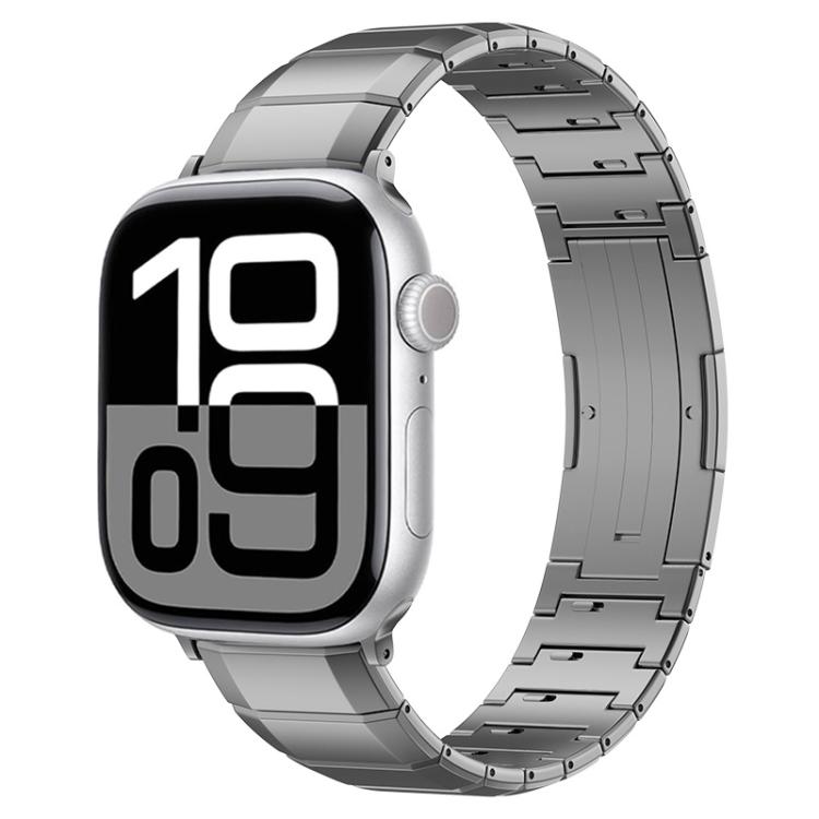 Gray titanium link band on a silver Apple Watch with digital time display