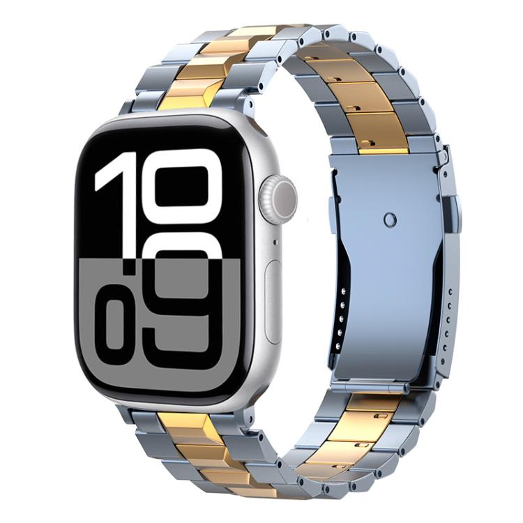 Blue-gray and gold titanium link band on an Apple Watch with a digital display.