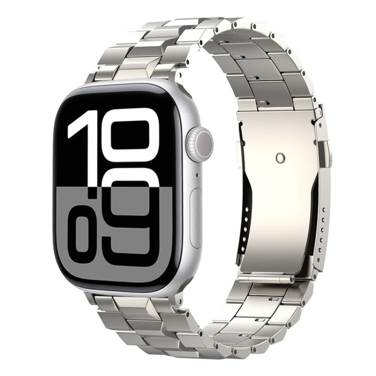 Silver titanium link watch band with a folding clasp on an Apple Watch