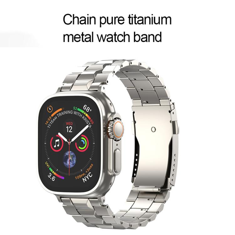 Silver titanium link watch band with a folding clasp on an Apple Watch