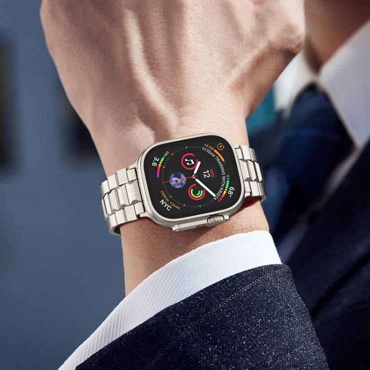 Silver titanium link watch band worn on the wrist