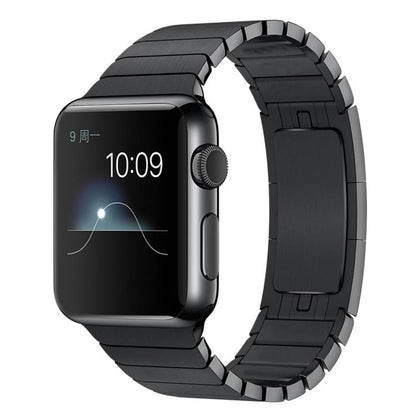 Black stainless steel Apple Watch band with linked metal segments, shown attached to a watch.