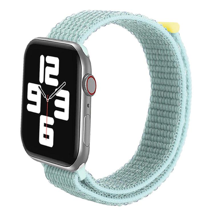 Mint green nylon hook-and-loop watch band wrapped around a smartwatch