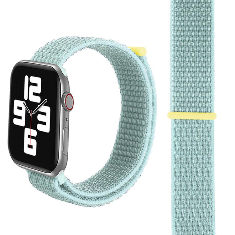 Mint green nylon watch band shown looped and flat