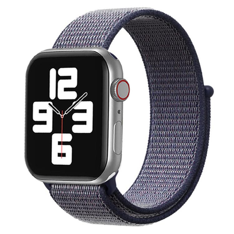 Apple Watch with a gray woven nylon band and dark navy hook-and-loop trim