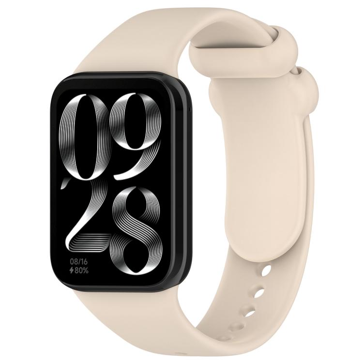 Cream silicone watch band with black smartwatch, loop closure and adjustment holes