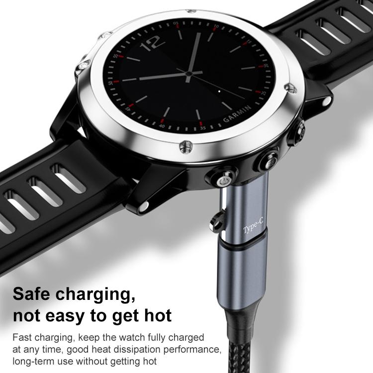 Straight charging adapter plugged into the back of a Garmin watch