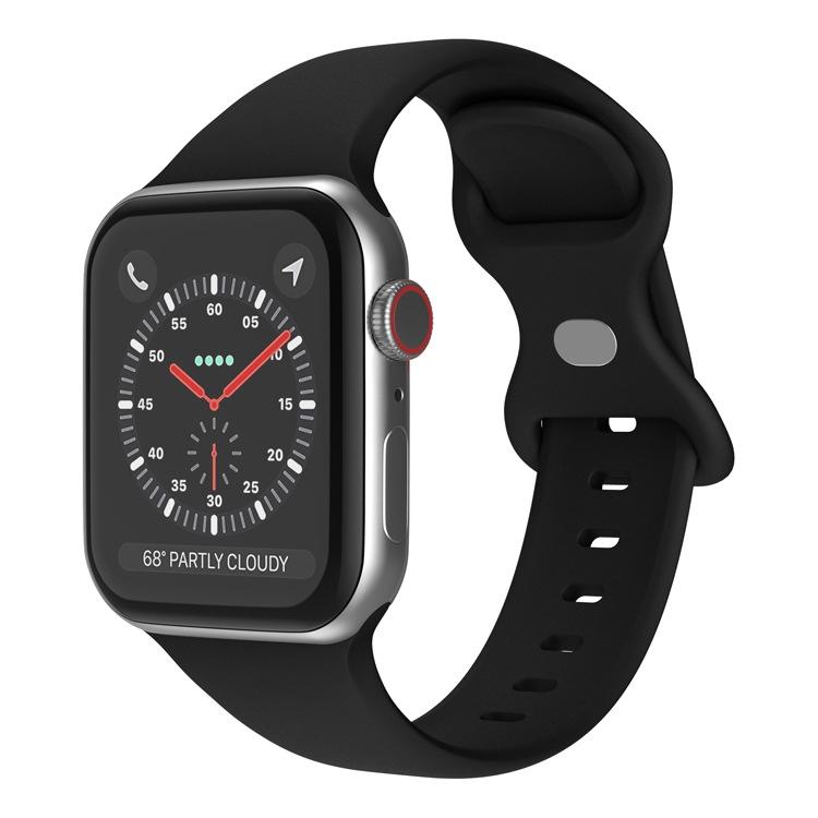 Black silicone butterfly buckle Apple Watch band shown attached to a watch