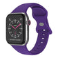 Purple silicone Apple Watch band with butterfly buckle, shown attached to a watch