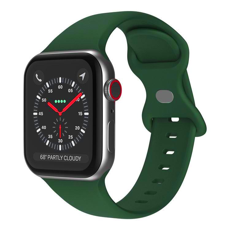 Dark green silicone Apple Watch band with butterfly buckle, shown attached to a watch