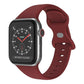 Wine red silicone butterfly buckle Apple Watch band shown attached to a watch