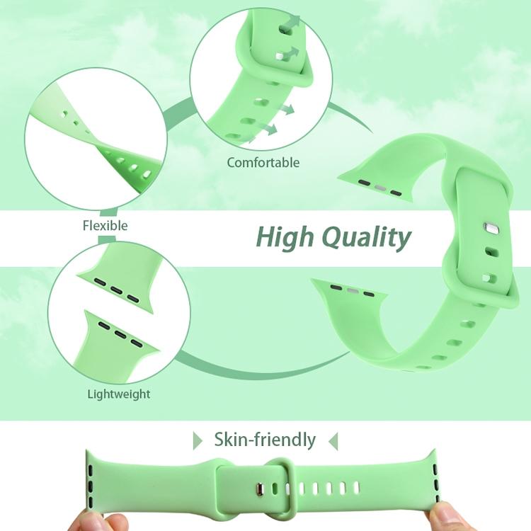 Green silicone Apple Watch band shown flexed, with adjustable holes and buckle