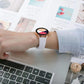 White silicone watch band worn with a round smartwatch
