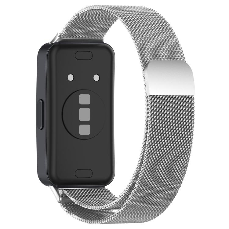 Silver Milanese metal watch band shown attached to the back of a black fitness tracker.