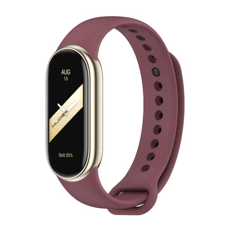 Burgundy silicone watch band with adjustment holes and metal buckle, shown on a smartwatch