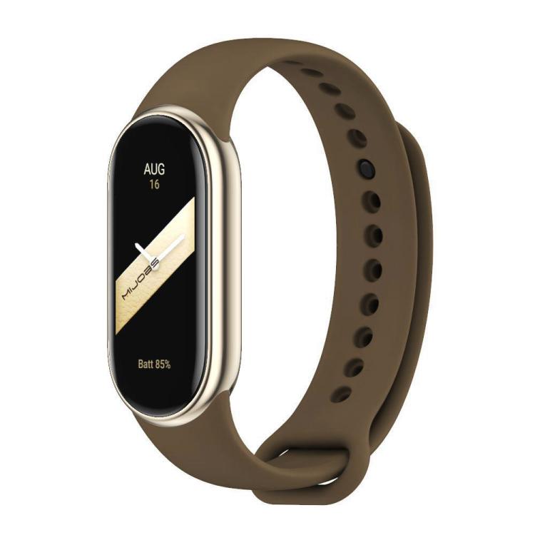 Brown silicone watch band with adjustment holes and metal buckle