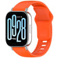 Orange silicone watch band with reverse buckle, shown on a smartwatch