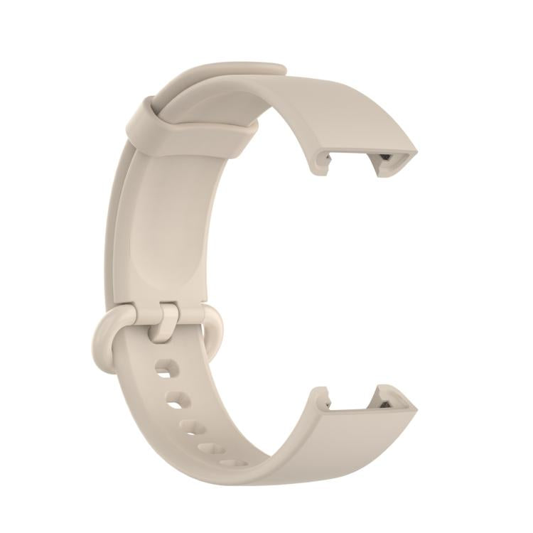 Ivory silicone watch band viewed from the inner side, showing its buckle and strap loop.
