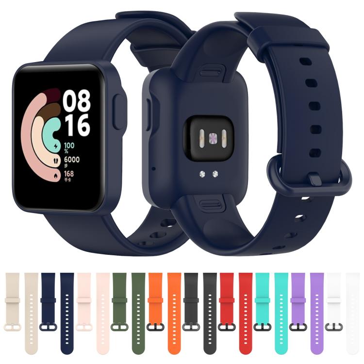 Navy silicone watch band fitted to a smartwatch, with other color options shown below.