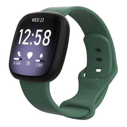 Fitbit-compatible dark green silicone watch band with a smartwatch and adjustable holes
