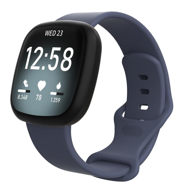 Fitbit smartwatch with a slate blue silicone band and adjustable buckle