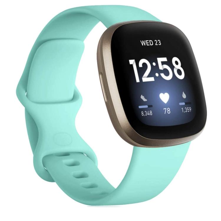 Mint silicone watch band fitted to a smartwatch, with adjustable buckle and pin holes