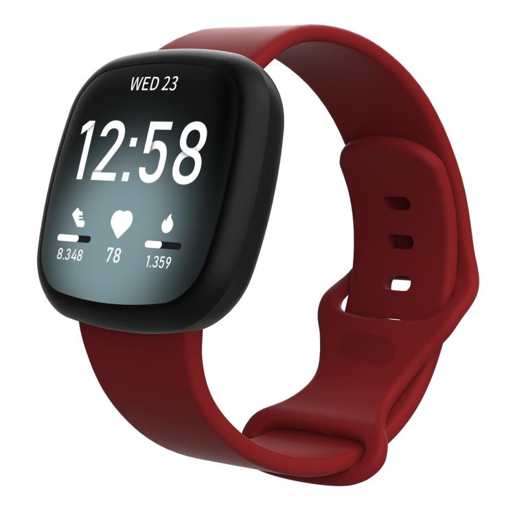 Dark red silicone watch band fitted to a black smartwatch, with adjustable buckle and pin holes