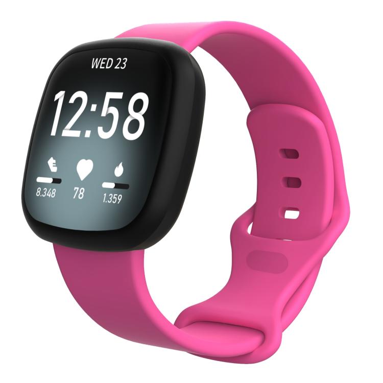 Bright pink silicone watch band fitted on a Fitbit smartwatch