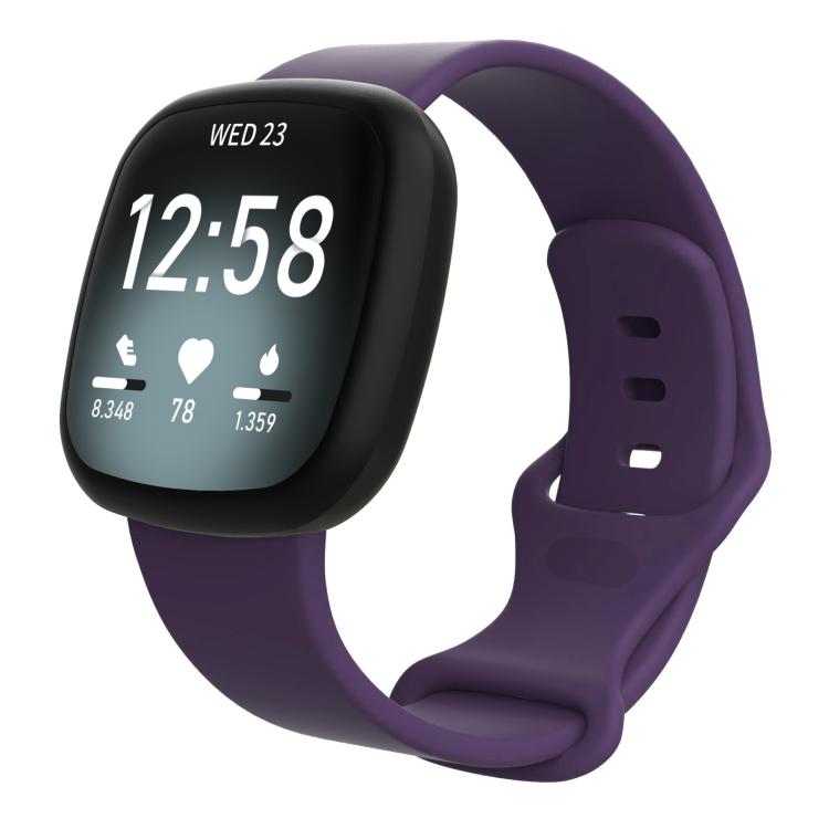 Dark purple silicone watch band fitted on a Fitbit smartwatch