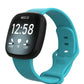 Teal silicone watch band fitted to a black smartwatch, with adjustable buckle and pin holes