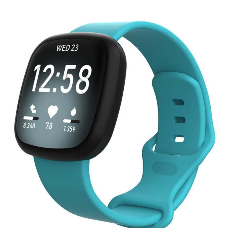Teal silicone watch band fitted to a black smartwatch, with adjustable buckle and pin holes