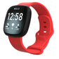 Bright red silicone watch band shown attached to a smartwatch, with an adjustable buckle.