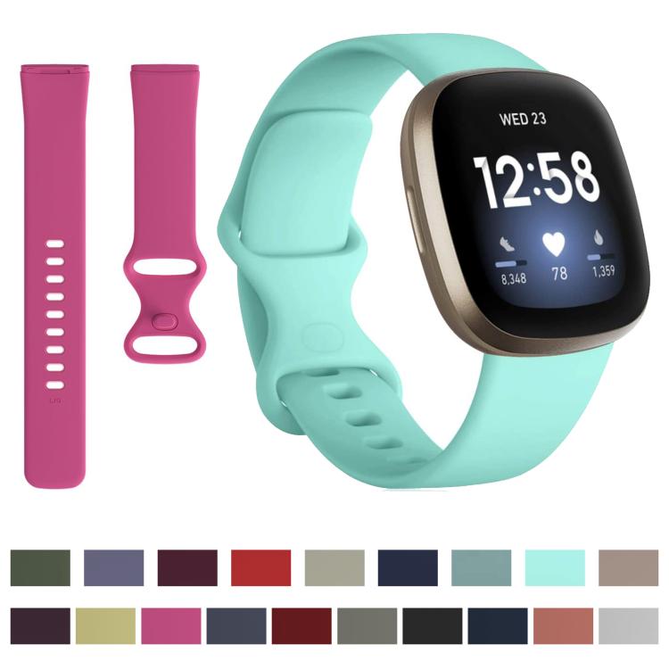 Silicone watch band set with two magenta strap pieces and a mint green band on a smartwatch.