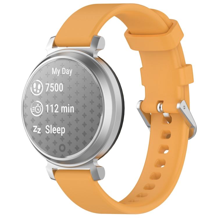 Golden orange silicone watch band with silver buckle on a silver Garmin Lily 2 watch.