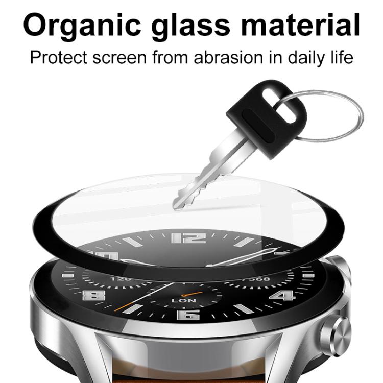 Clear watch screen protector floating above a black-dial watch to illustrate scratch protection