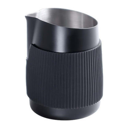 Black stainless latte art cup with ribbed silicone grip and wide metal rim