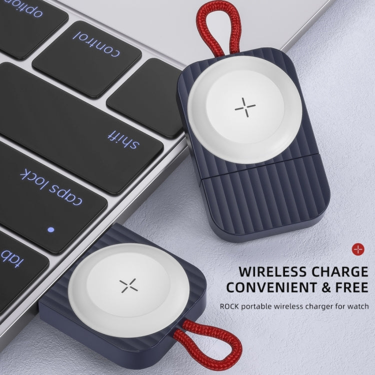 Blue magnetic wireless watch charger with white pad and red braided cord, angled