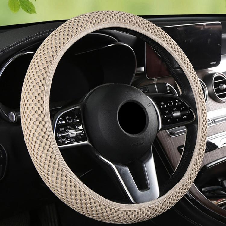 Beige textured steering wheel cover with elastic anti-slip grip around steering wheel