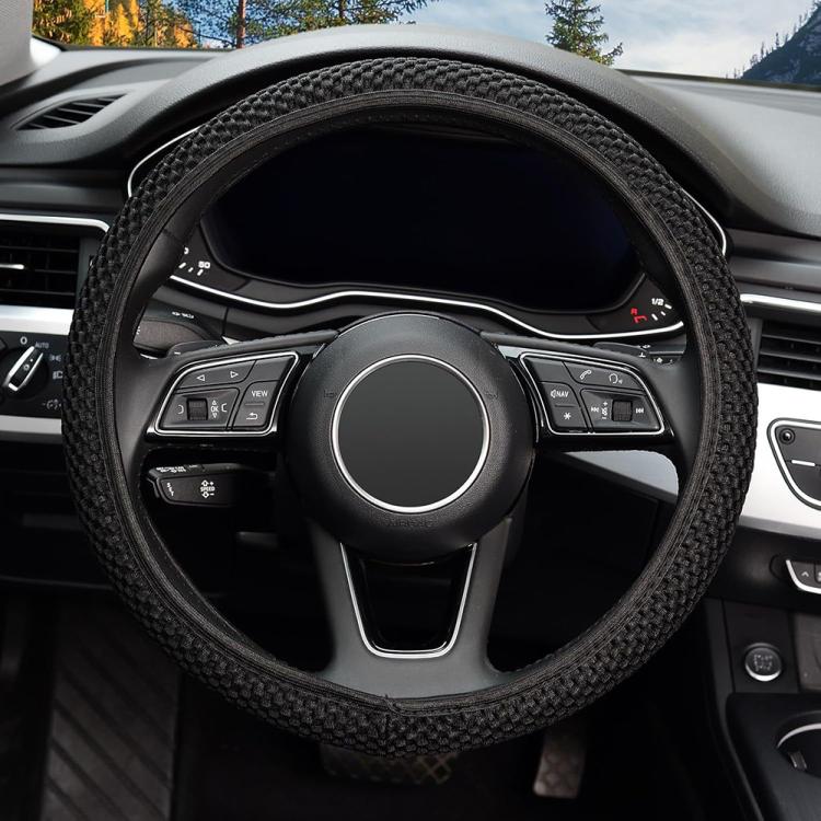 Black textured steering wheel cover with elastic anti-slip grip over steering wheel