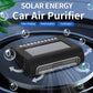Solar car air purifier on dashboard, black solar panel and front air vent