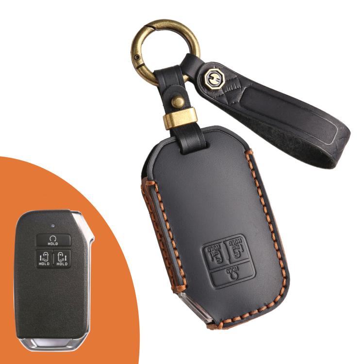 Black leather key fob protection cover with gold key ring and button panel