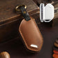 Brown leather key fob protection cover with key ring, stitched edges, button cutout